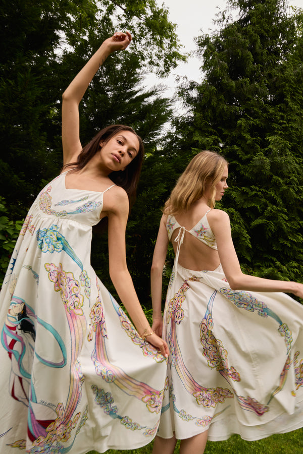 Du & Berry white midi summer dress with colorful floral patterns worn by two women outdoors