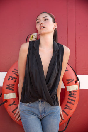 Du & Berry Twist Collared Top in Black sleeveless with deep V neckline styled with jeans