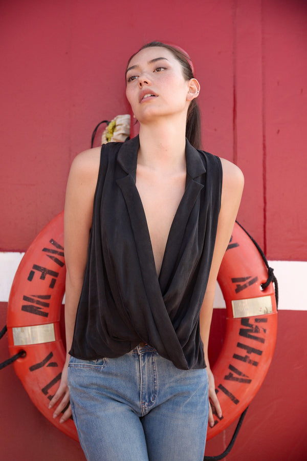 Du & Berry Twist Collared Top in Black sleeveless with deep V neckline styled with jeans
