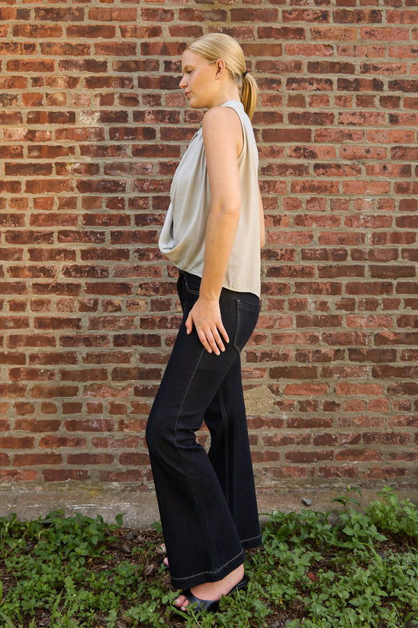 Woman wearing Du & Berry Grey Twist Collared Top paired with black wide-leg pants outdoors