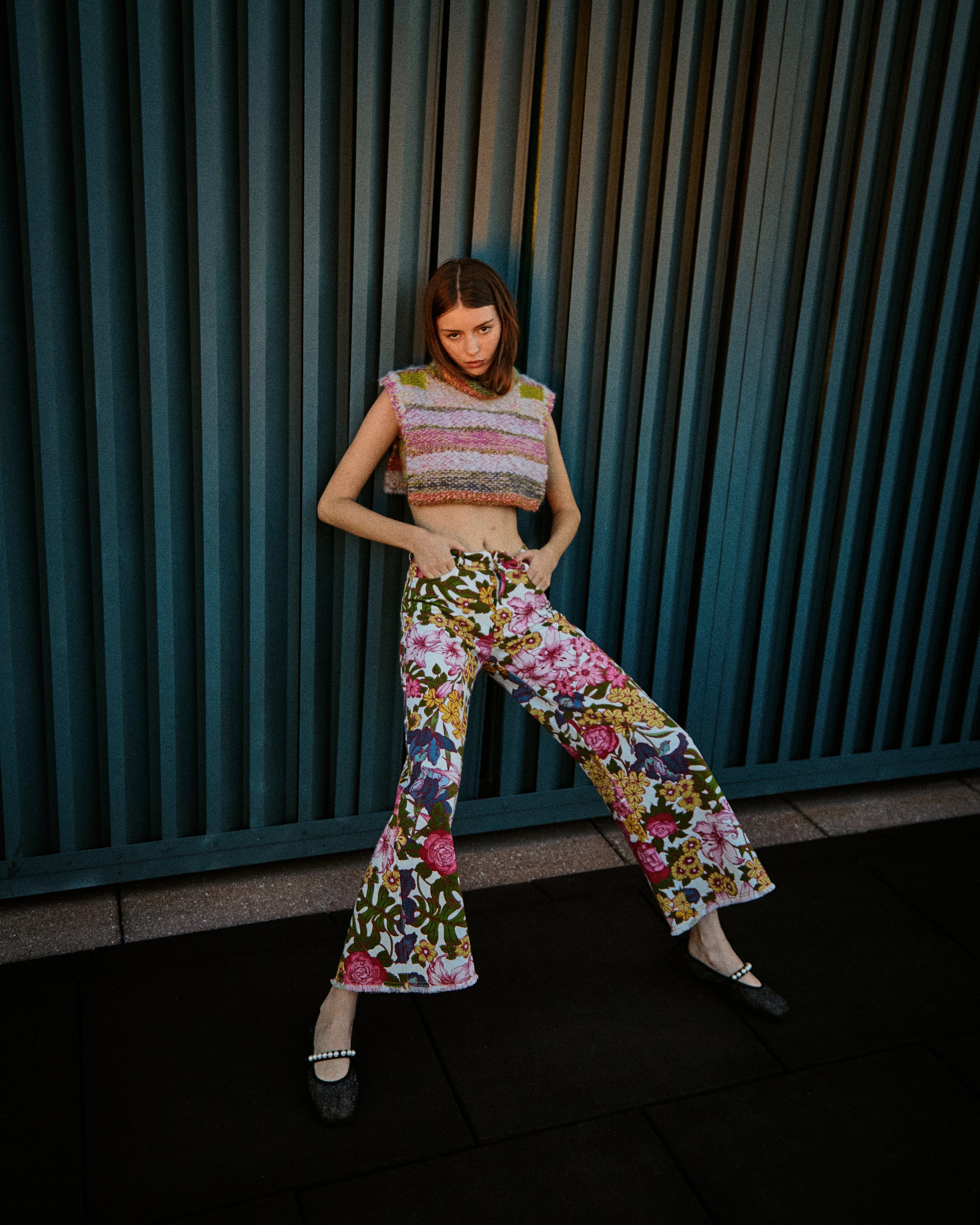 Model Sephira wearing Du & Berry Floral Symphony Jeans featuring hand drawn floral print with the Du & Berry One of A Kind Striped Turtleneck Cropped Knit Sweater Top