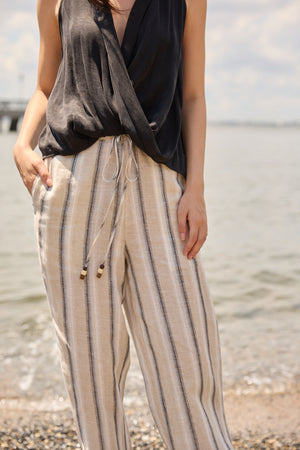 Du & Berry wide leg beach pants for women in beige with vertical stripes and drawstring waist