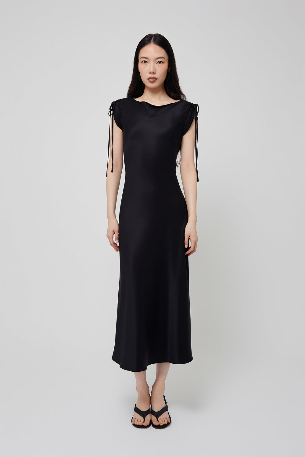 Du & Berry black midi dress with adjustable shoulder ties and sleek silhouette