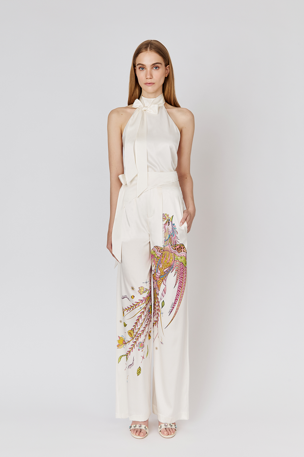 Full length view on model wearing Moon Silk white Halter Top and Phoenix Silk Trousers