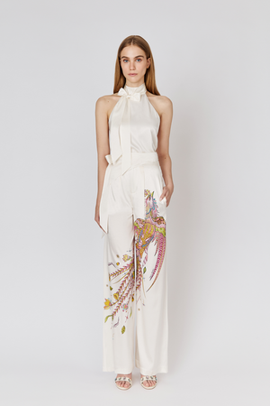 Full length view on model wearing Moon Silk white Halter Top and Phoenix Silk Trousers