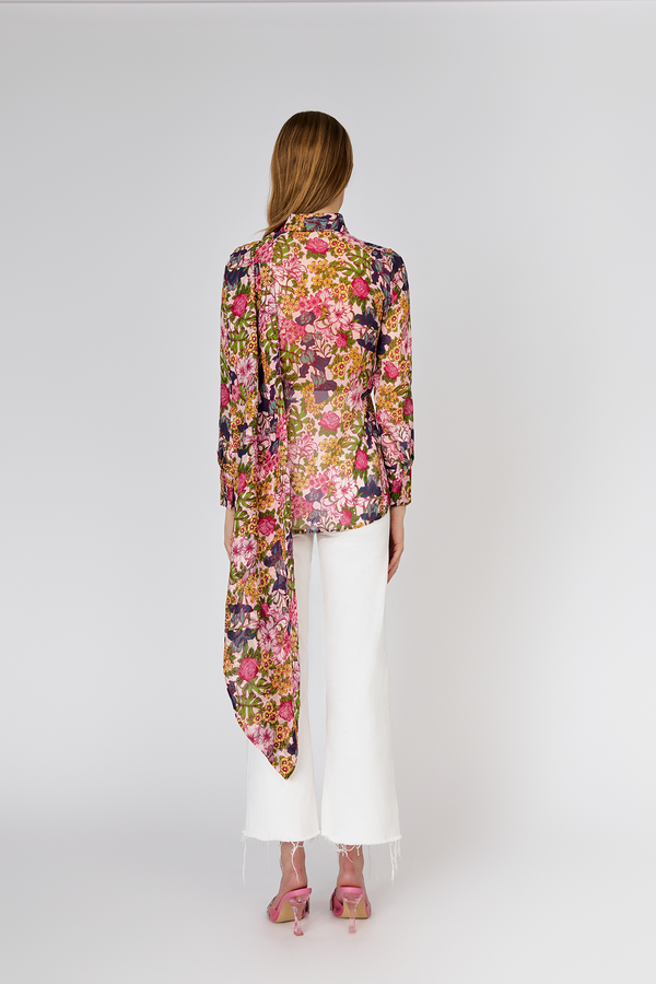 Back view of model wearing Du & Berry Floral Symphony Silk Chiffon Pink Button Up Blouse with scarf detail