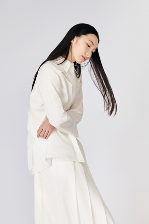 Model wearing Du & Berry Du Cotton Pleated Shirt & Skirt Matching Separates