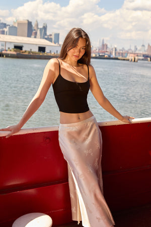Du & Berry Beige Jacquard Long Skirt worn by model with black top by waterfront city background