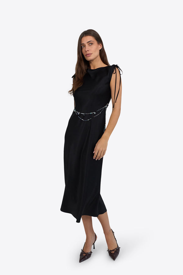 Du & Berry black midi dress with sleeveless design and side tie details modeled by woman