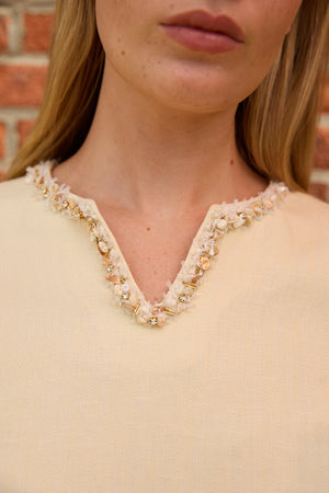 Close-up of Beige Split Neck Linen Dress by Du & Berry with beaded embellishments on neckline