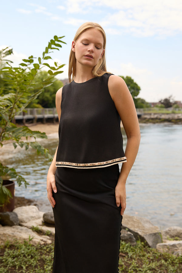 Du & Berry Black Linen Top Skirt Set worn by woman standing near a waterfront with greenery