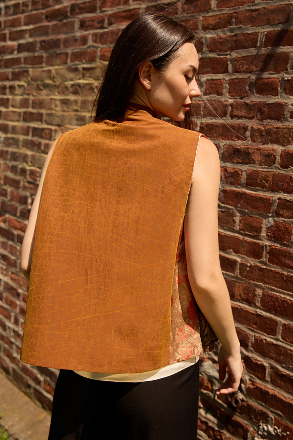 Du & Berry Embroidery Mulberry Silk Vest in rust color worn by model against brick wall