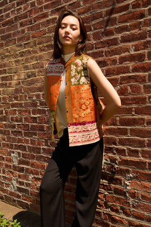 Du & Berry Embroidery Mulberry Silk Vest in orange and green worn with black pants and white top