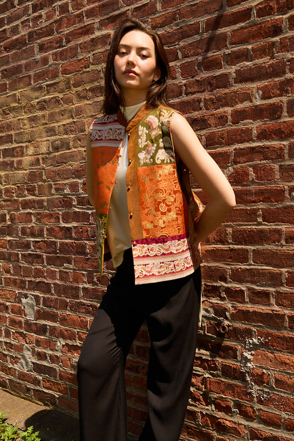Du & Berry Embroidery Mulberry Silk Vest in orange and green worn with black pants and white top