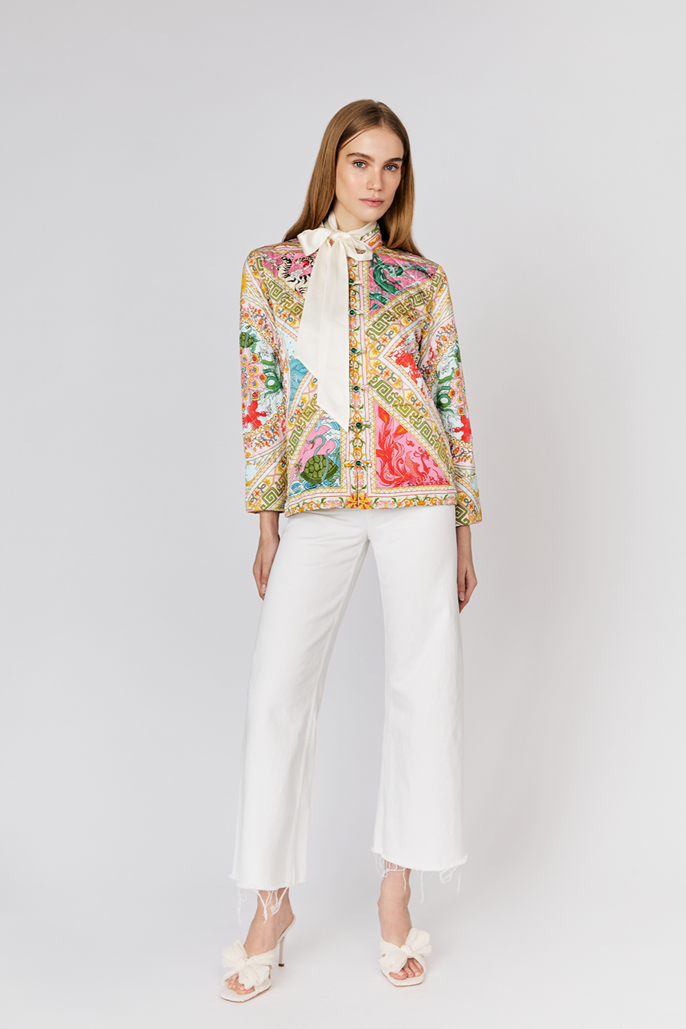 Front view: colorful Four Divine Creatures quilted jacket with vibrant floral patterns and intricate designs