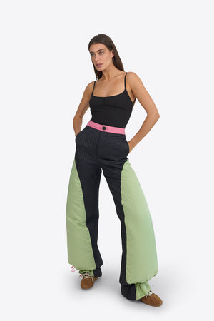 Du & Berry Origami Puffer Down Pants in black and green with pink waistband worn by model