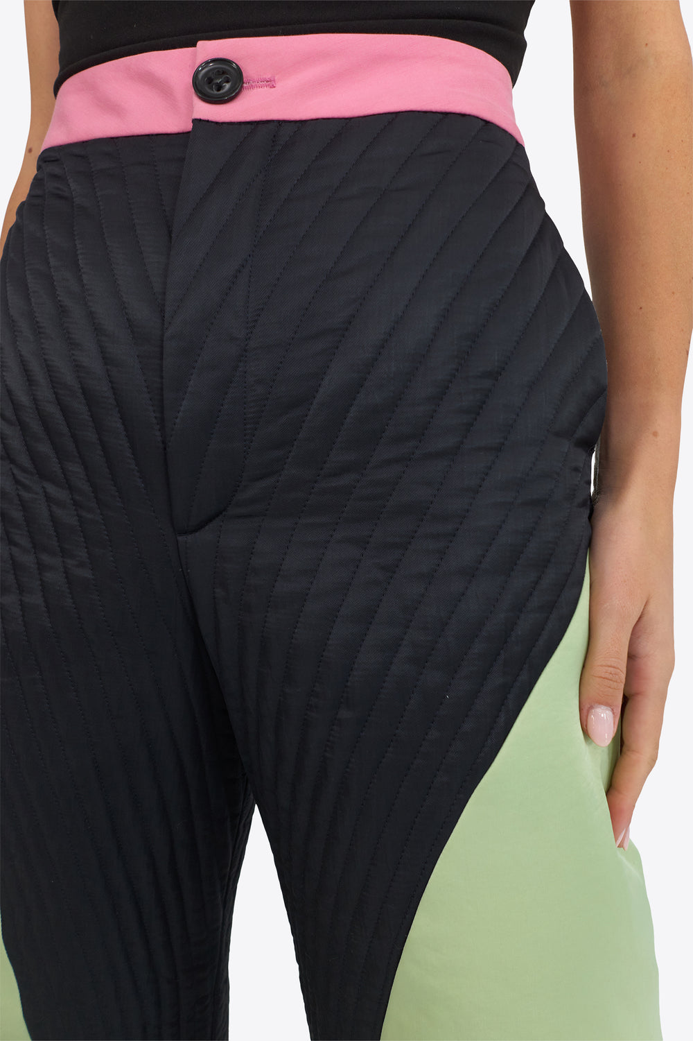 Du & Berry Origami Puffer Down Pants in black and green with pink waistband on model