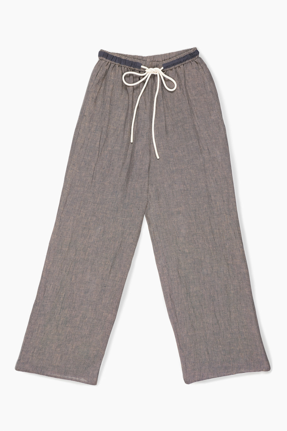 Du & Berry women's casual brown drawstring trousers styled with a white shirt and navy crop top by the waterfront