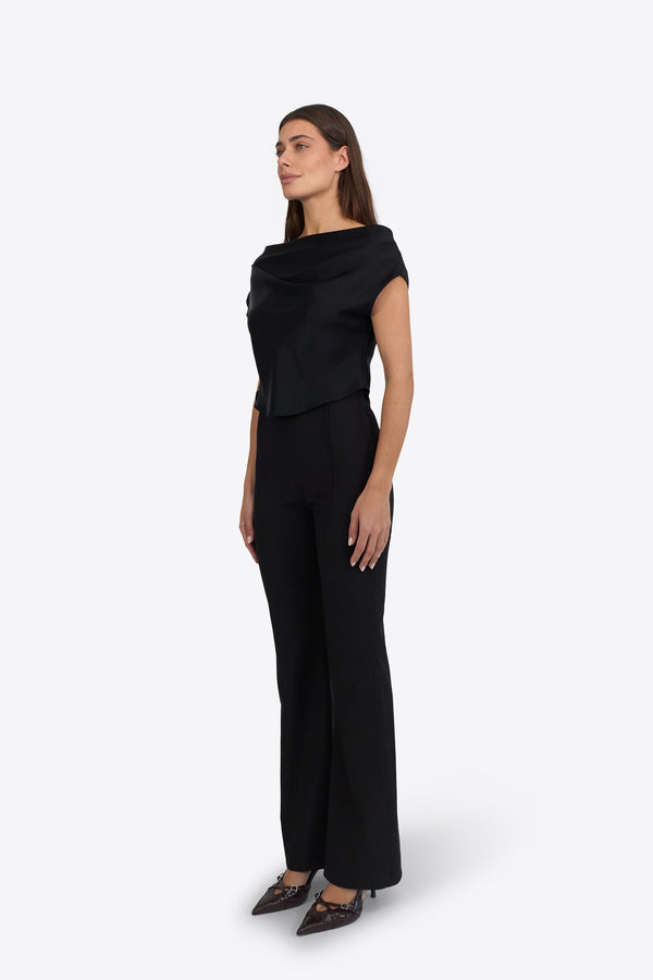 Du & Berry Draped Top in Deep Black worn by model paired with black pants and high heels