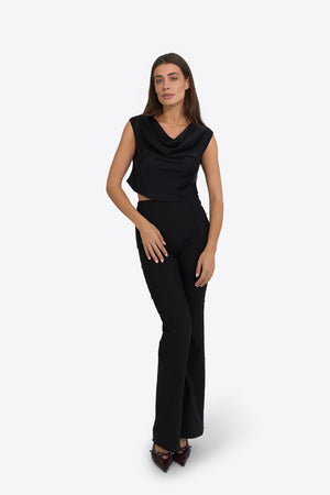 Woman wearing Du & Berry Draped Top in Deep Black with matching black pants and heels