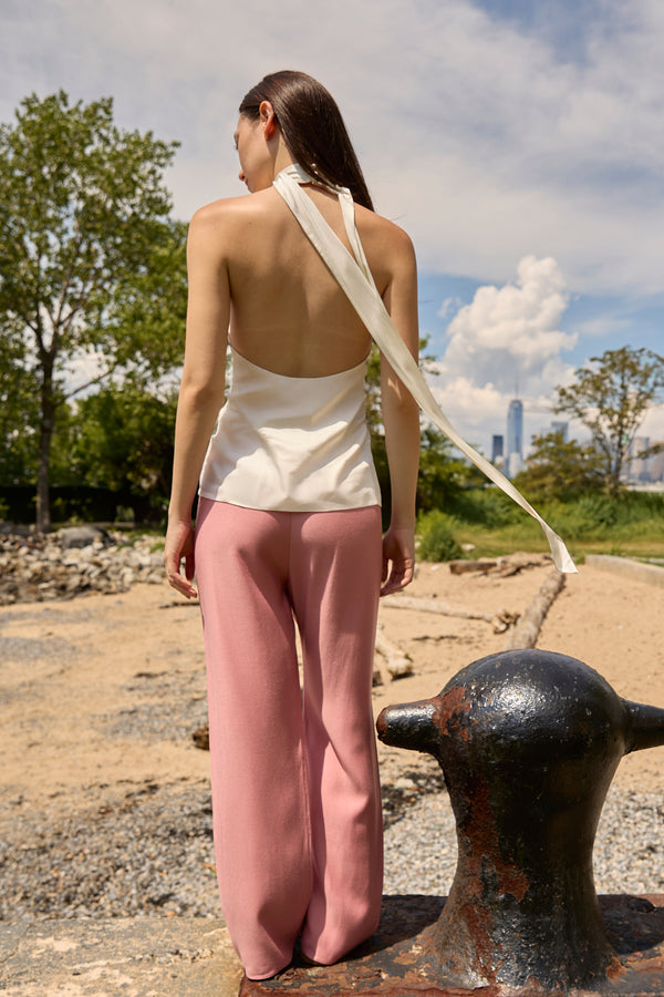 Du & Berry dusty rose straight pants worn by a woman standing outdoors with a white halter top