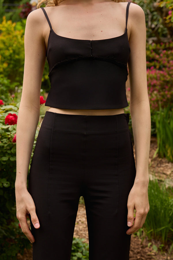 Du & Berry set featuring a high-rise soft-flared pant and a structured open-back top in black