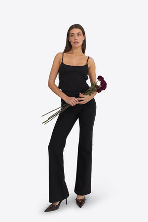 Du & Berry set featuring high-rise soft-flared pant and a structured open-back top in black