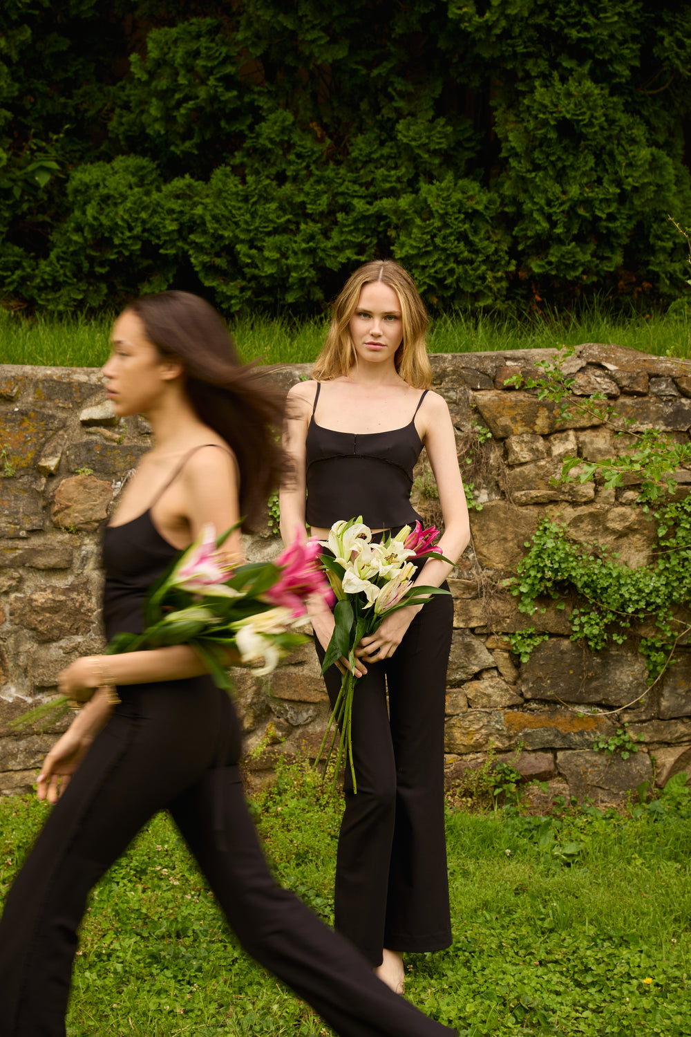 Du & Berry set featuring a high-rise soft-flared pant and a structured open-back top in black outdoors
