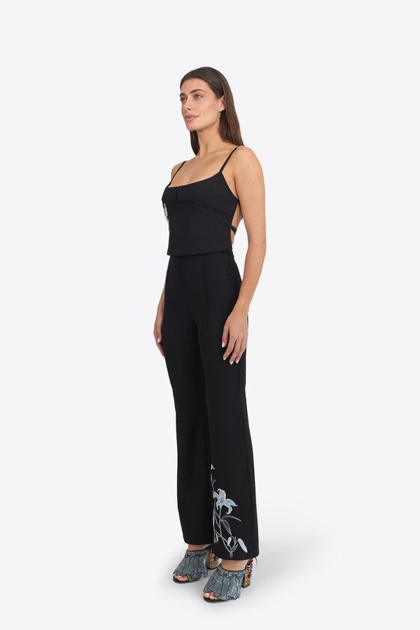 Du & Berry black trousers featuring light blue flower embroidery pants detail near the hem