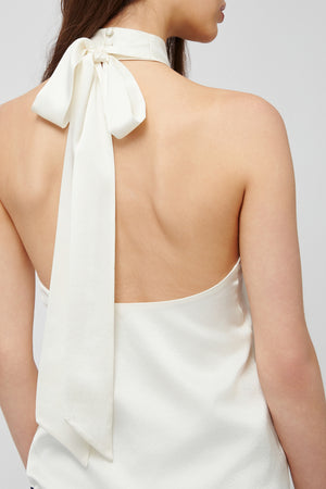 Back view of white halter blouse from Du & Berry with a bow tie detail