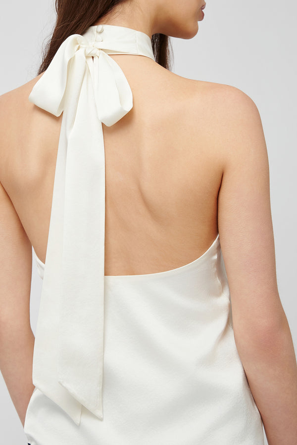 Back view of white halter blouse from Du & Berry with a bow tie detail