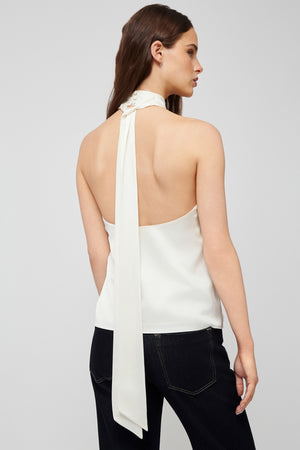 Back view: white halter blouse in lightweight fabric with tie detail from Du & Berry