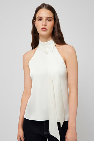 Front view: white halter blouse made of lightweight fabric with a stylish neck tie