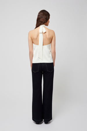 Back view of a white halter blouse from Du & Berry with a ribbon tie detail