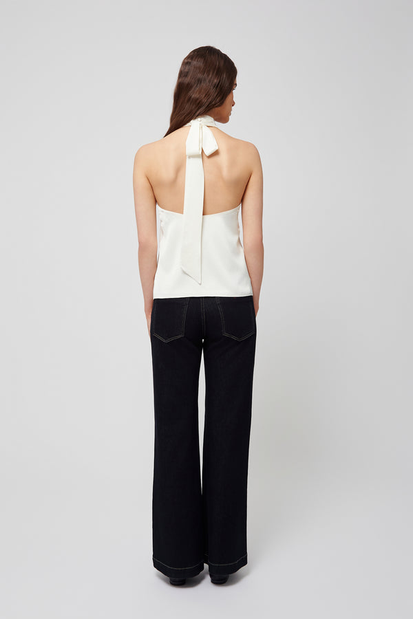 Back view of a white halter blouse from Du & Berry with a ribbon tie detail